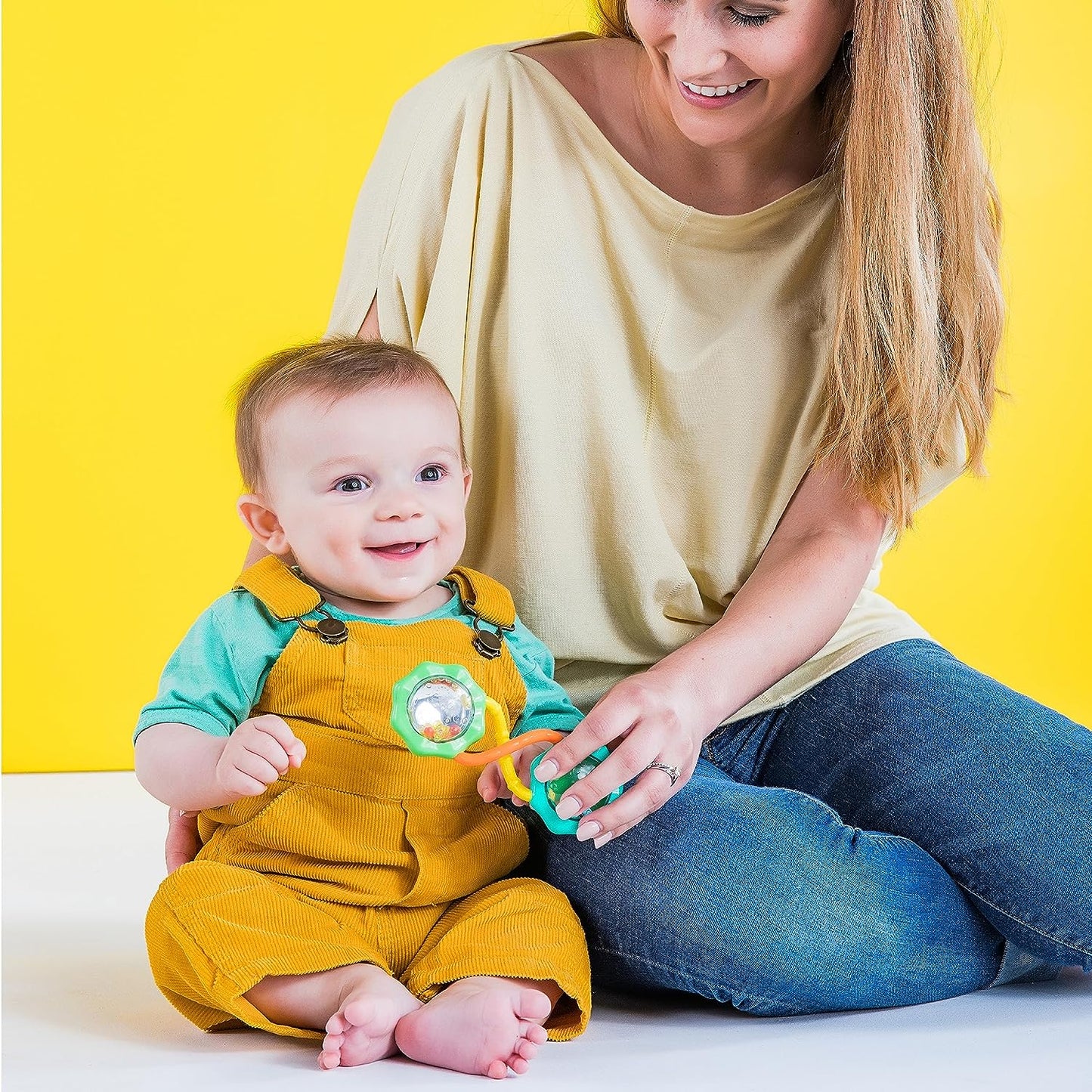 "Fun and Stimulating Rattle & Shake Barbell Toy for Babies 3 Months and up - Vibrant Green Color!"