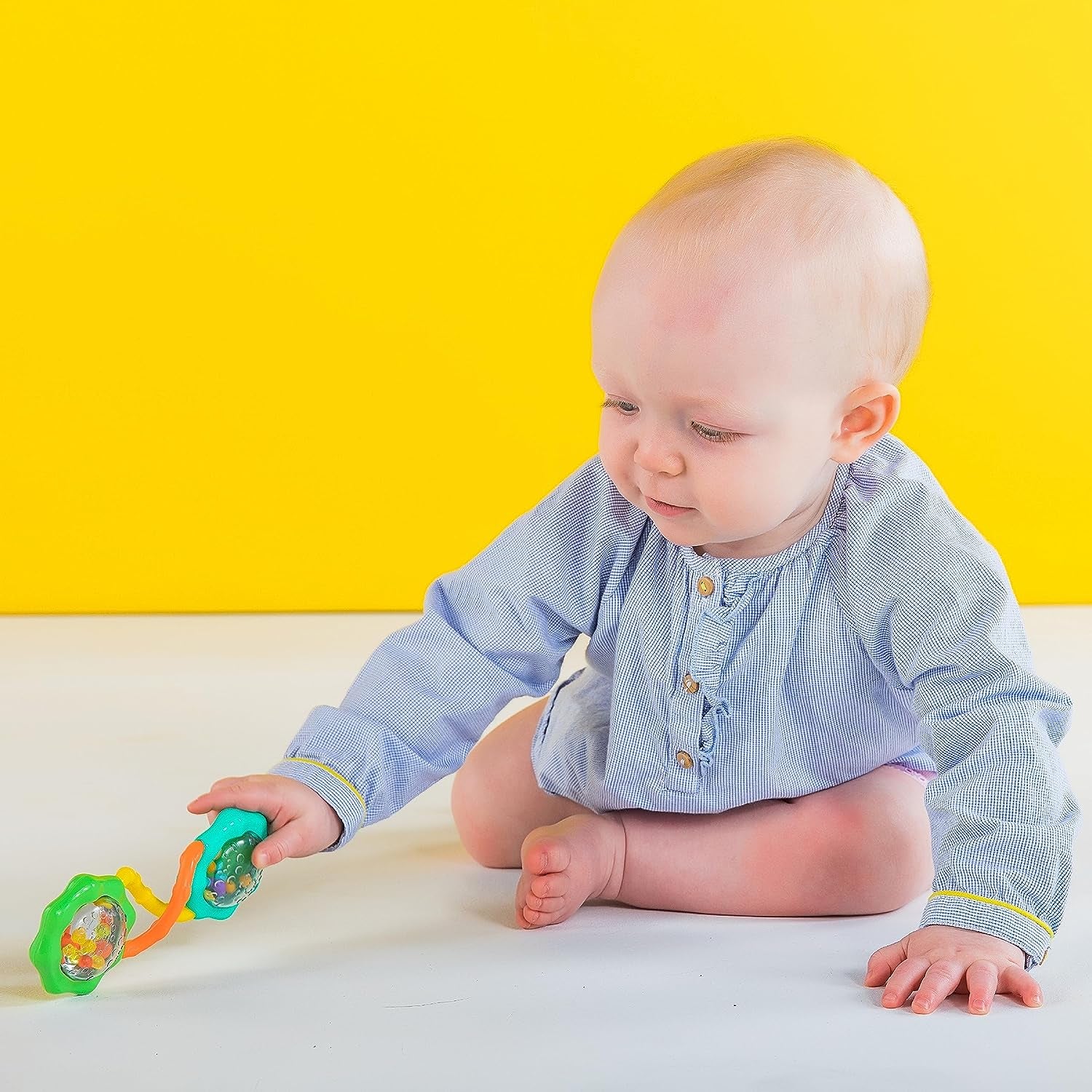 "Fun and Stimulating Rattle & Shake Barbell Toy for Babies 3 Months and up - Vibrant Green Color!"